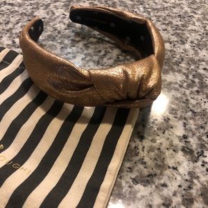 Lele Sadoughi gold headband.